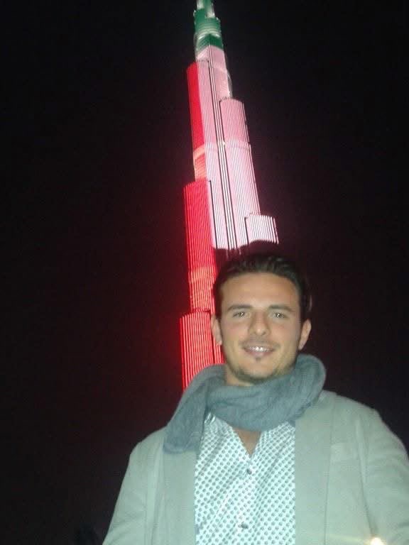 Filippo in front of the Burj Khalifa lit up at night